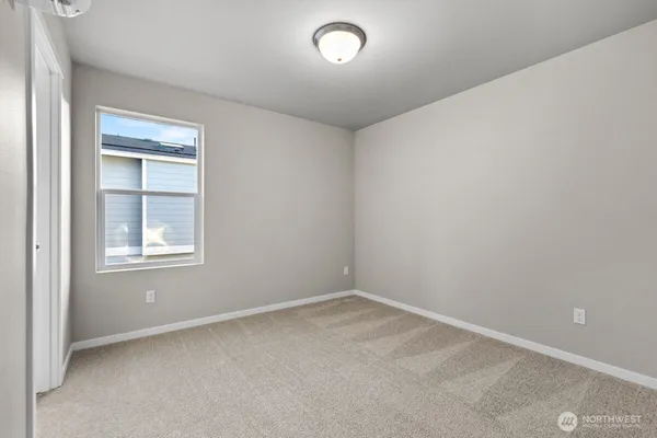 a bathroom with a sink a toilet and a window