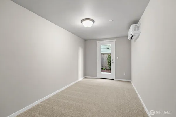 an empty room with a empty space and windows