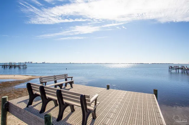 a view of a terrace with wooden floor and lake view