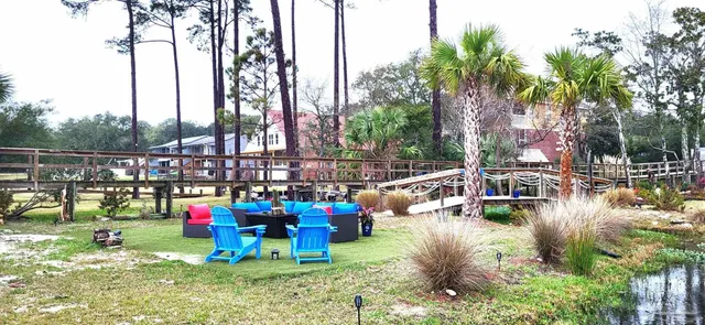 a view of swimming pool with sitting area and slide