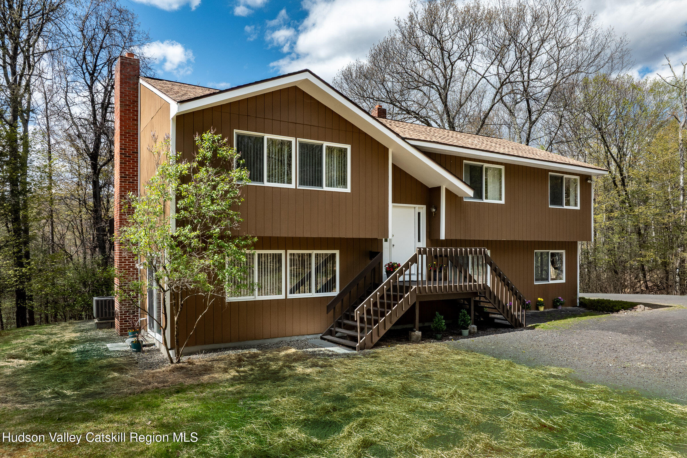 170 Macdaniel Road Woodstock, NY 12498 - Photo 1 of 31 a front view of a house with a yard
