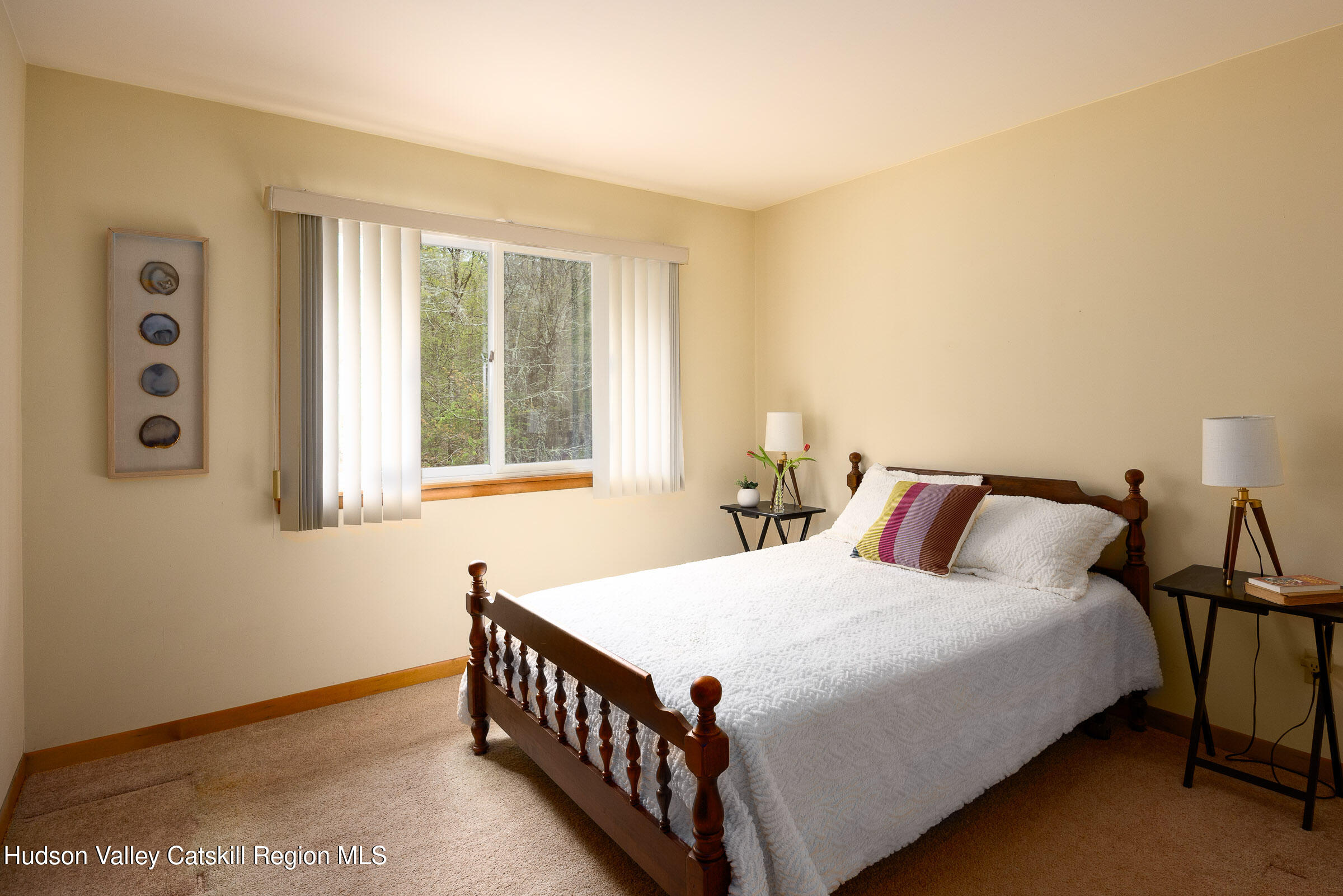 170 Macdaniel Road Woodstock, NY 12498 - Photo 16 of 31 a bedroom with a bed and a window