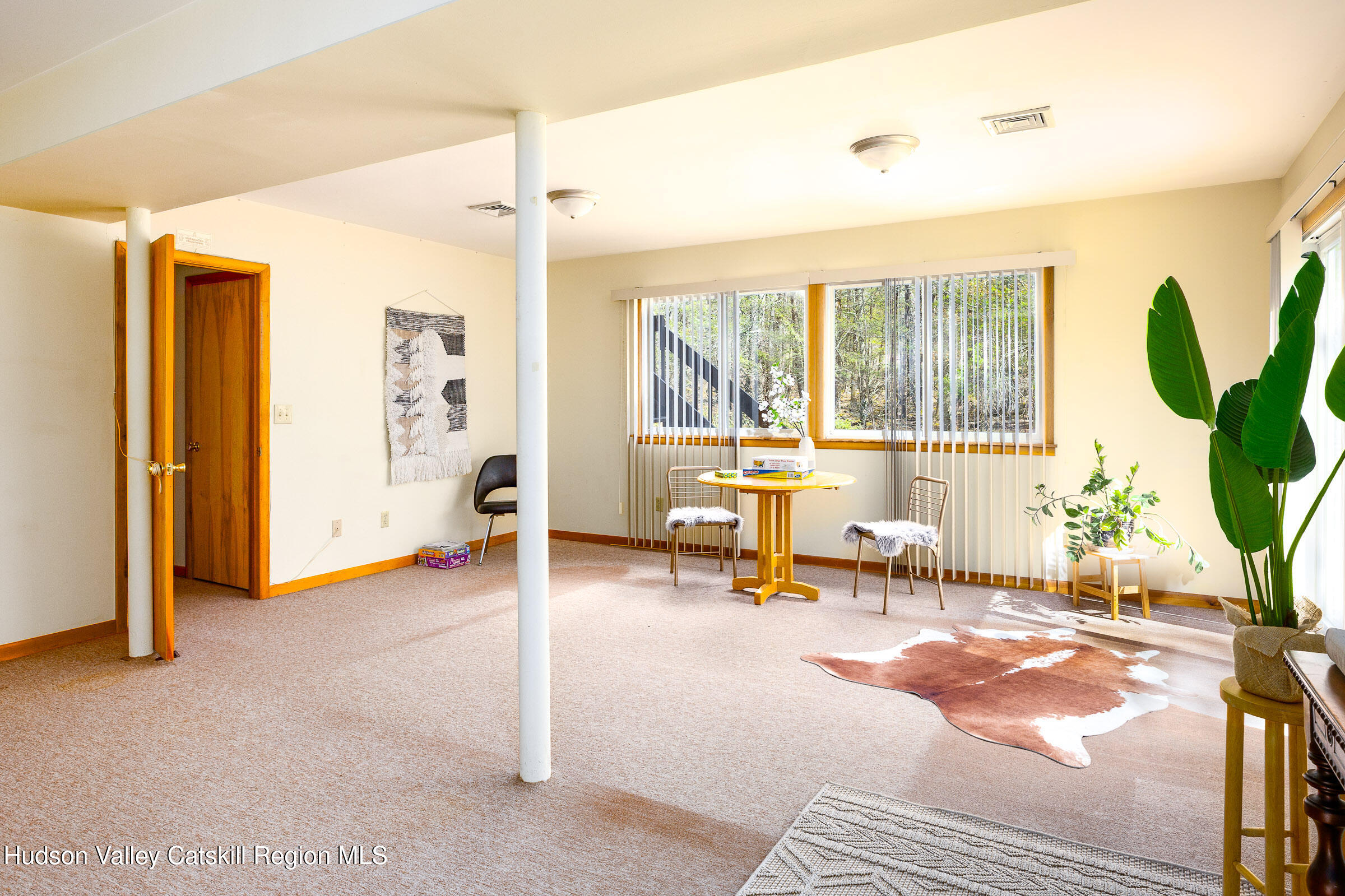 170 Macdaniel Road Woodstock, NY 12498 - Photo 17 of 31 a living room with furniture and a large window