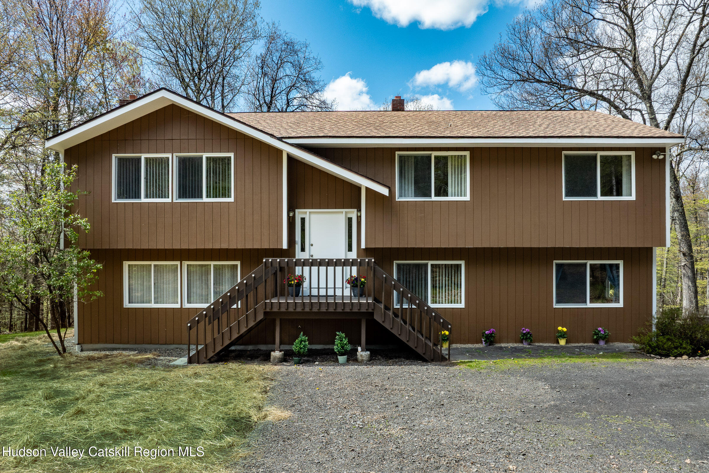 170 Macdaniel Road Woodstock, NY 12498 - Photo 22 of 31 a view of a house with a yard and wooden fence