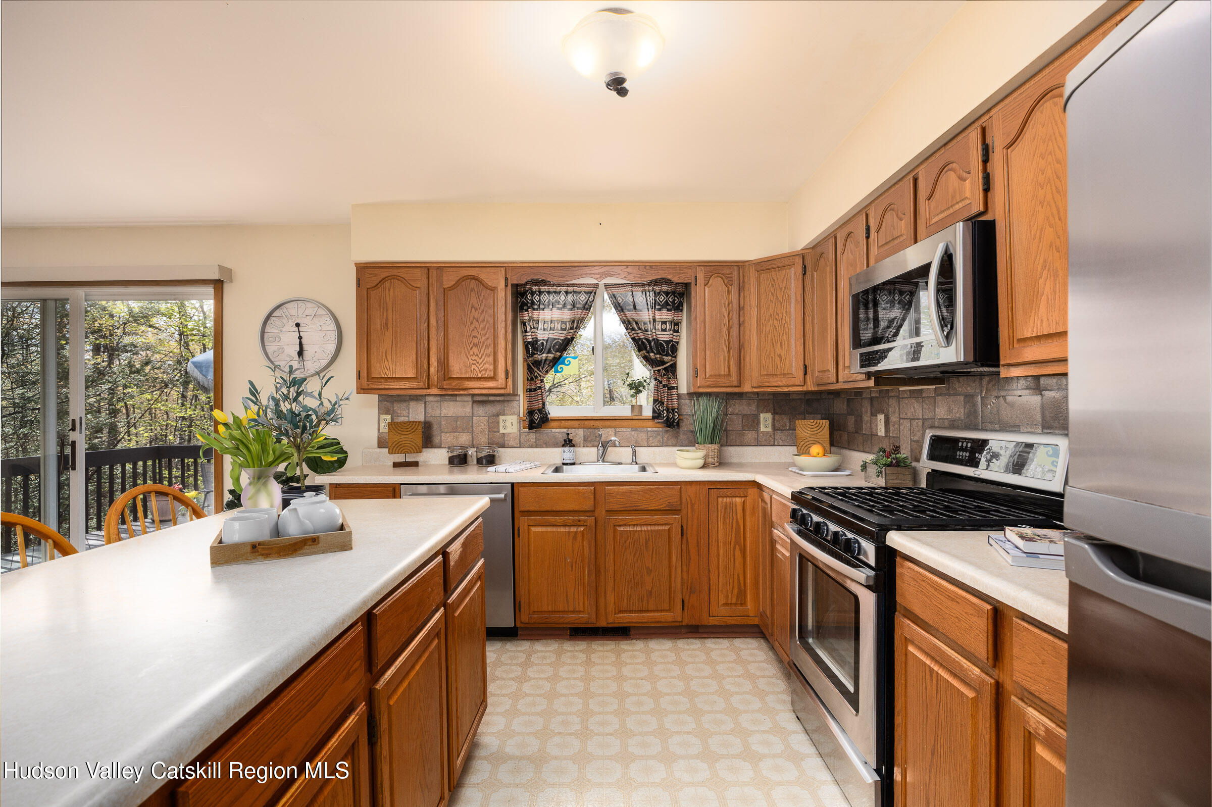 170 Macdaniel Road Woodstock, NY 12498 - Photo 9 of 31 a kitchen with stainless steel appliances granite countertop a sink stove and cabinets