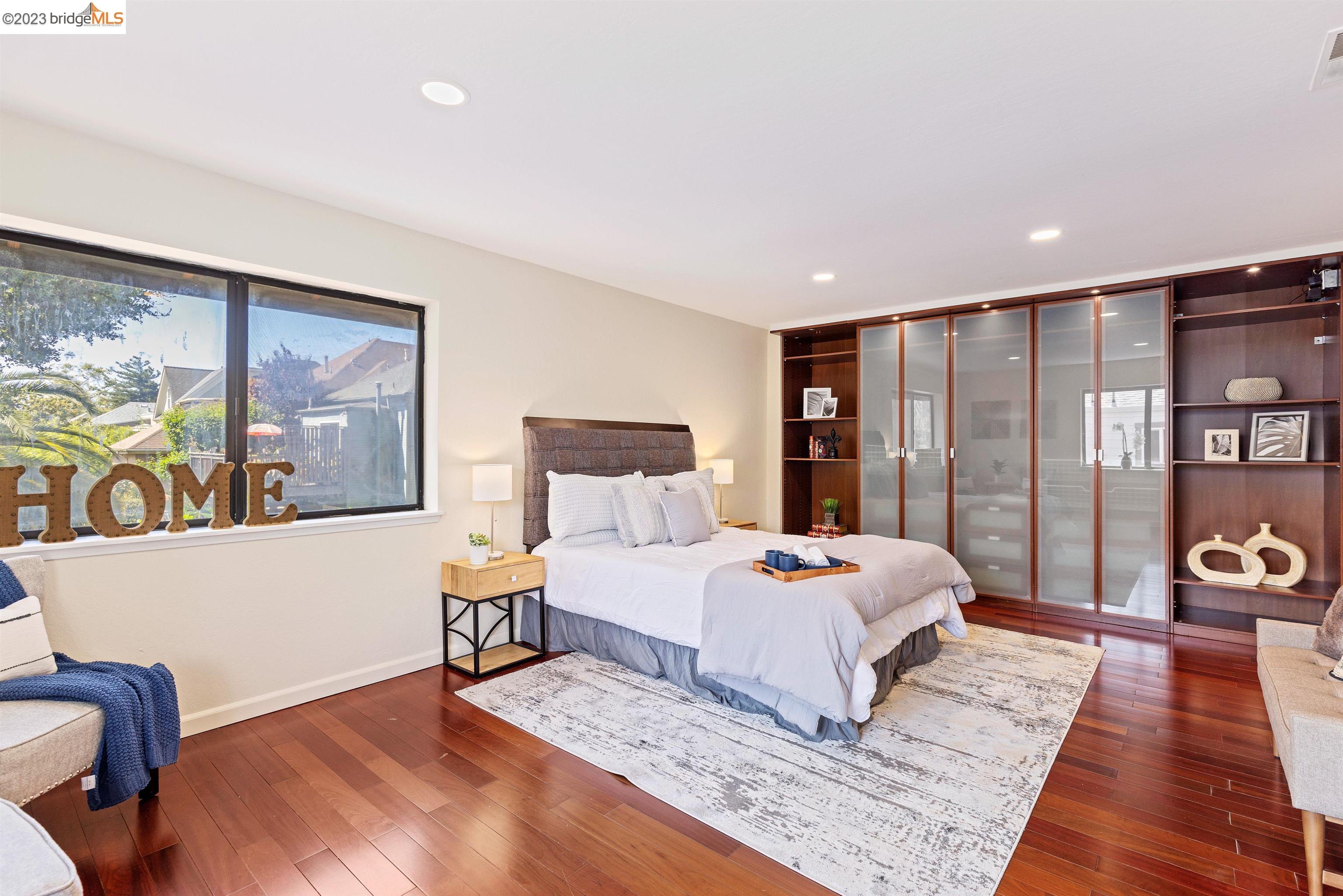 1015 16th Street Oakland, CA 94607 - Photo 1 of 1 a bedroom with a large bed and a couch