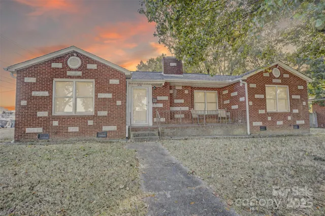 a backyard of a house with lots of trees