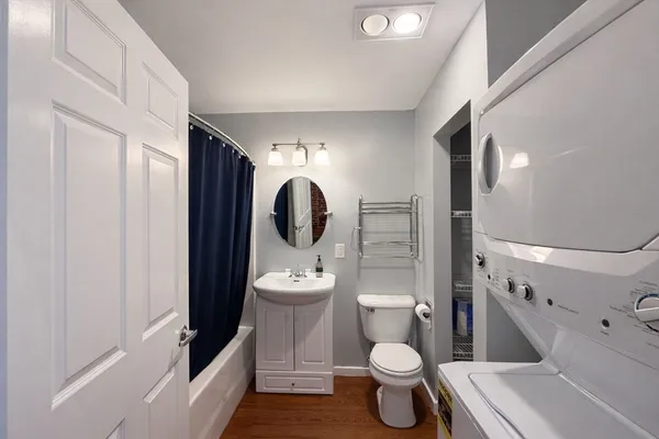 a bathroom with a toilet and a sink