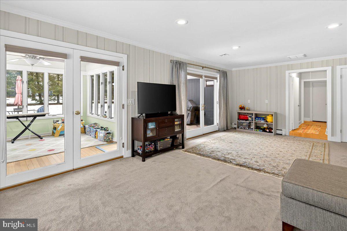 14 Baldwin Street Pennington, NJ 08534 - Photo 21 of 42 a living room with furniture and a flat screen tv