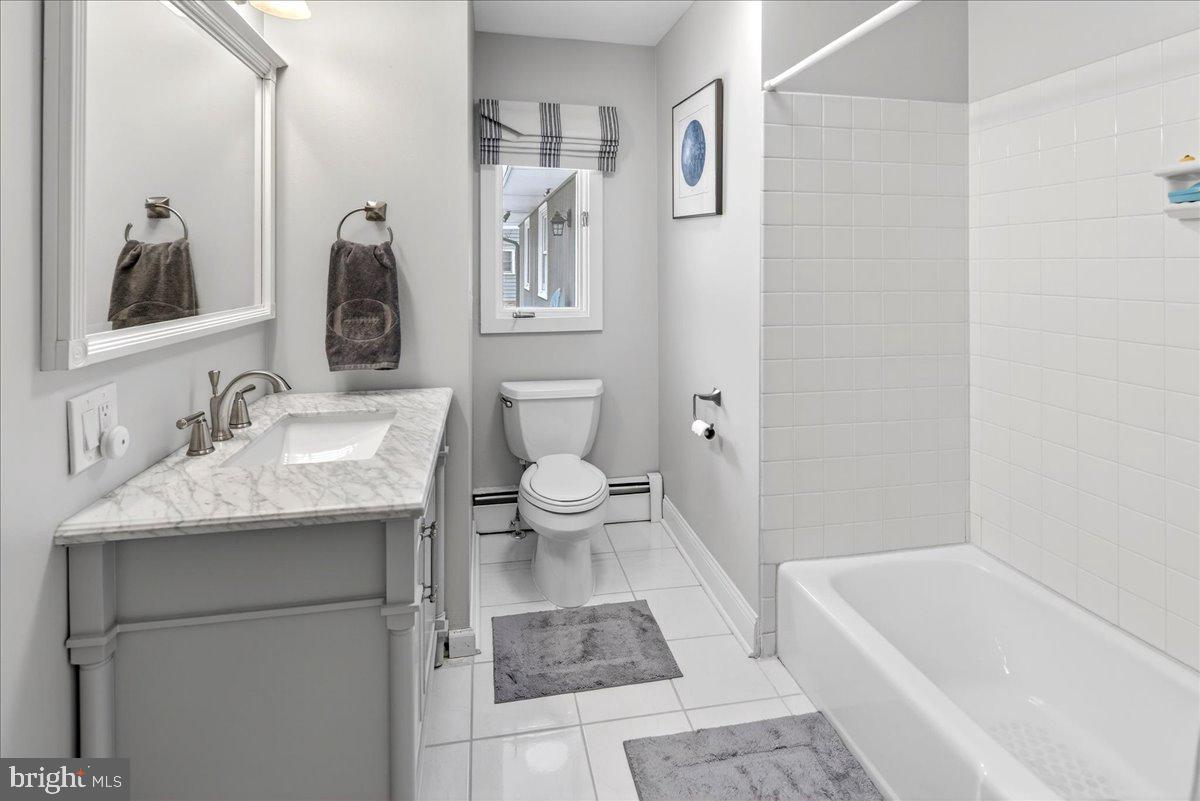 14 Baldwin Street Pennington, NJ 08534 - Photo 24 of 42 a bathroom with a sink a toilet and shower