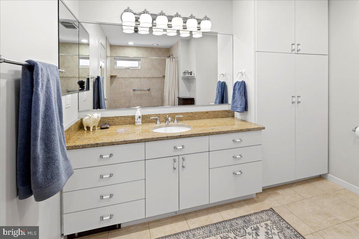 14 Baldwin Street Pennington, NJ 08534 - Photo 28 of 42 a bathroom with a sink double vanity and a mirror