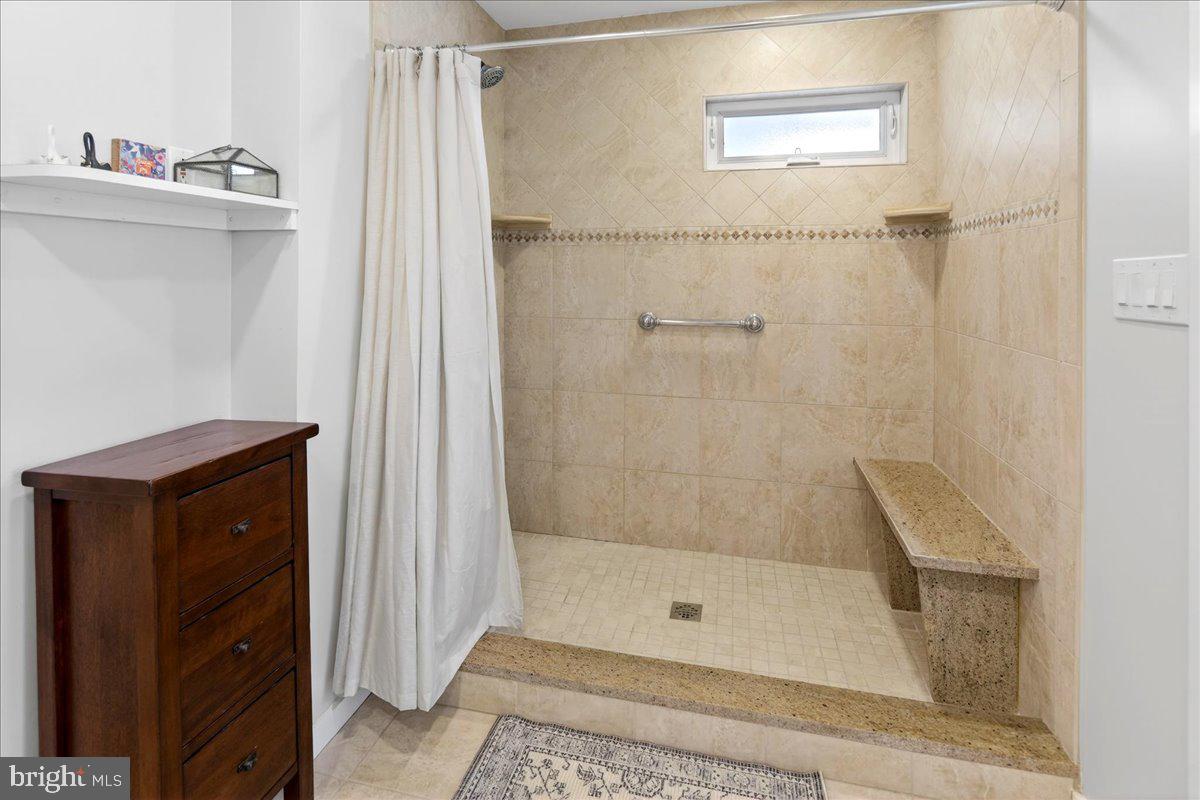 14 Baldwin Street Pennington, NJ 08534 - Photo 29 of 42 a bathroom with a shower and a sink