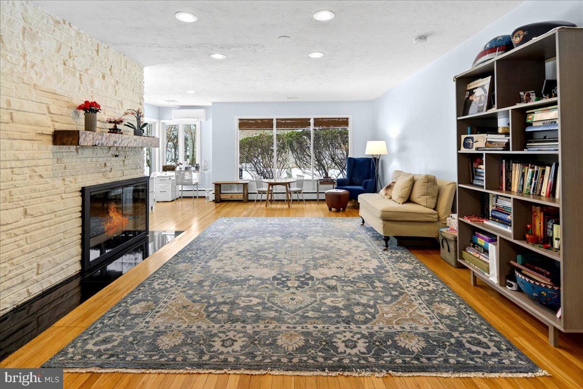 14 Baldwin Street Pennington, NJ 08534 - Photo 3 of 42 a living room with furniture and a fireplace