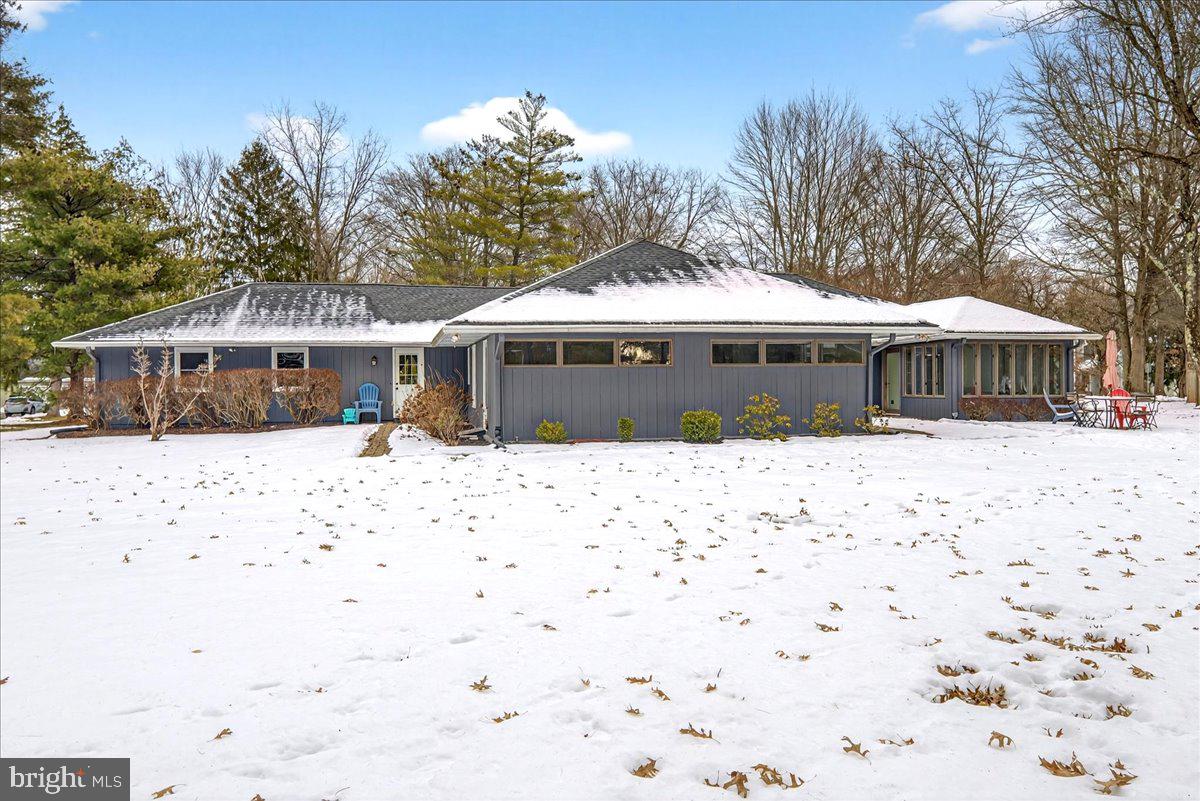14 Baldwin Street Pennington, NJ 08534 - Photo 41 of 42 a front view of a house with a yard covered with trees
