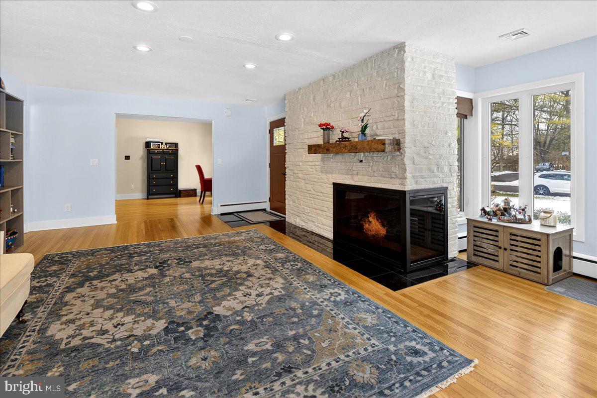 14 Baldwin Street Pennington, NJ 08534 - Photo 6 of 42 a living room with furniture and a fireplace