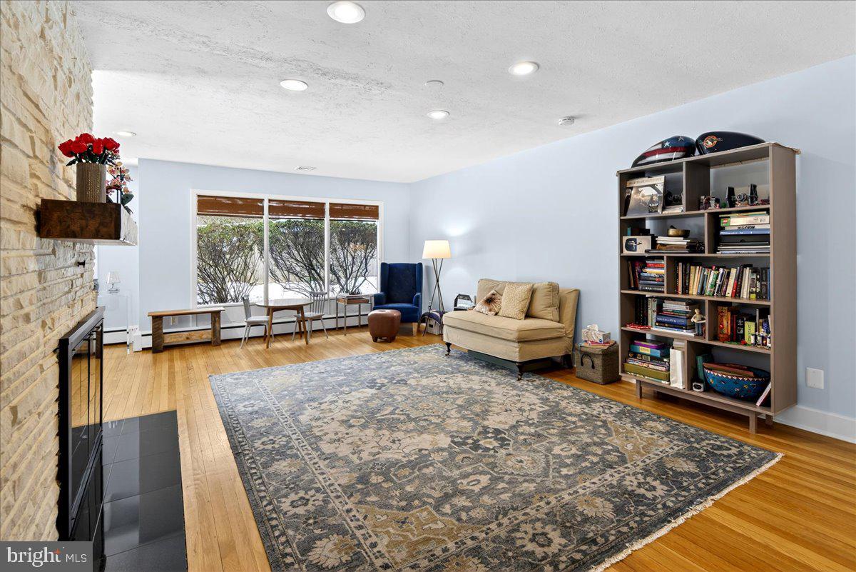 14 Baldwin Street Pennington, NJ 08534 - Photo 7 of 42 a living room with furniture or couch and a bookshelf