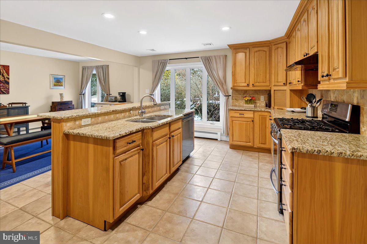 14 Baldwin Street Pennington, NJ 08534 - Photo 10 of 42 a kitchen with stainless steel appliances granite countertop a stove a sink and a refrigerator
