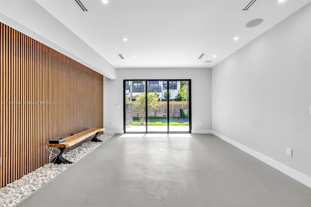 an empty room with sliding door