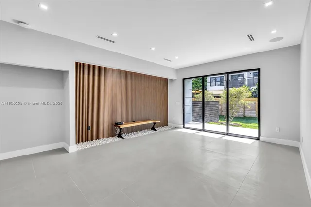 an empty room with sliding door