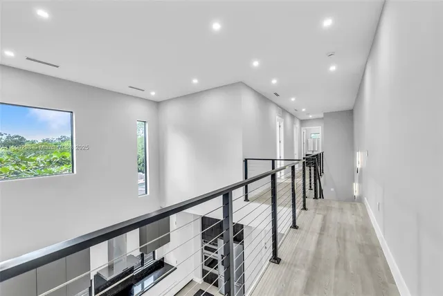 a view of an entryway with wooden floor
