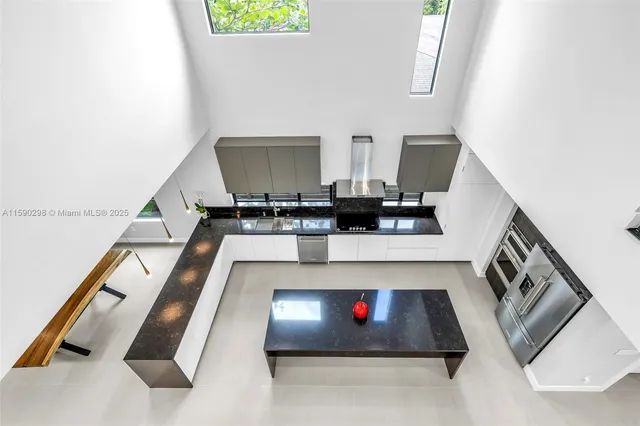 a kitchen with sink and cabinets