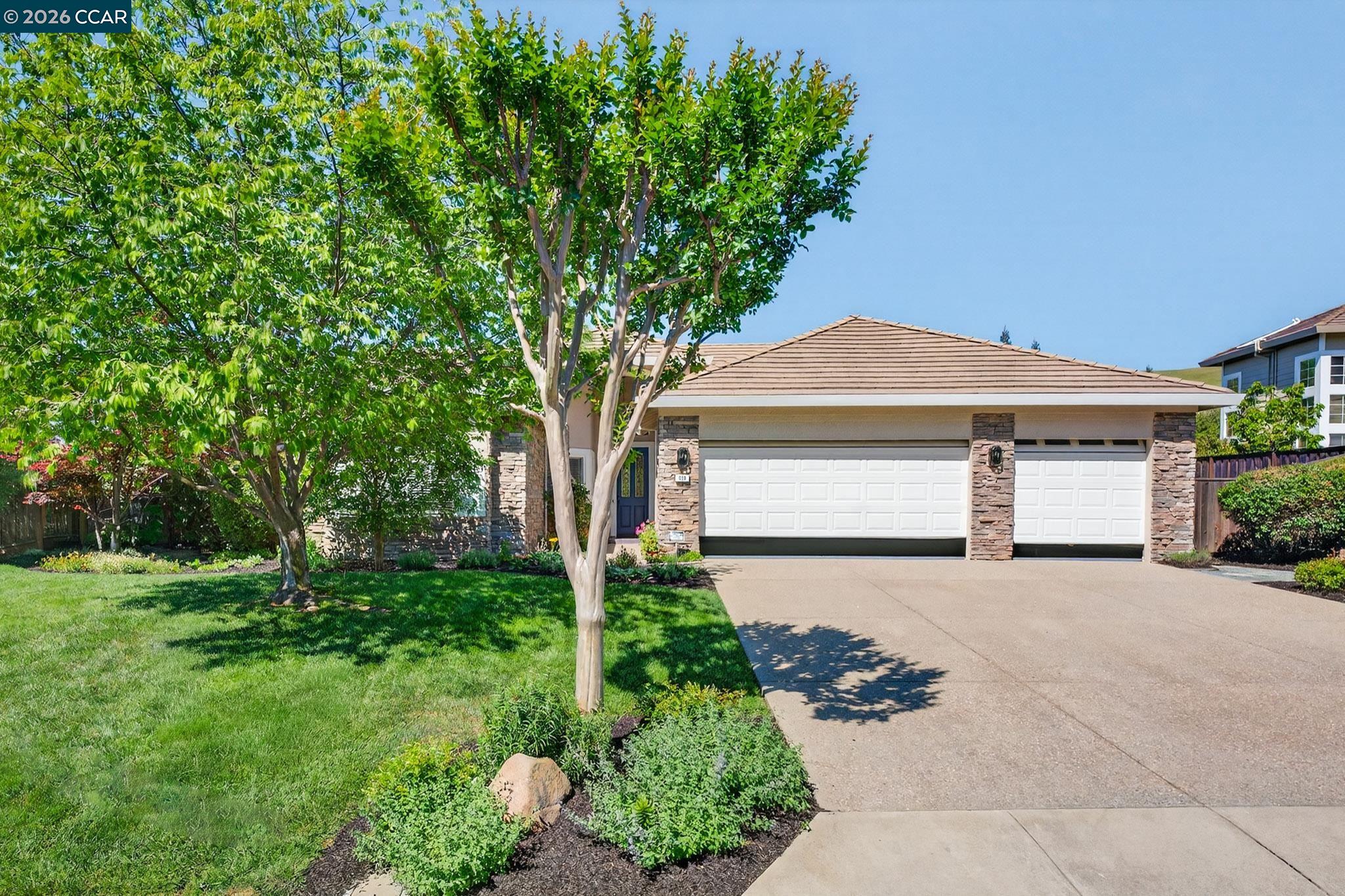 599 Timberleaf Court Walnut Creek, CA 94598 - Photo 1 of 1 a front view of a house with a yard and garage