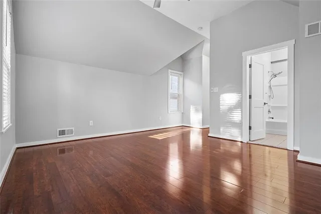 a bathroom with a sink vanity mirror and toilet