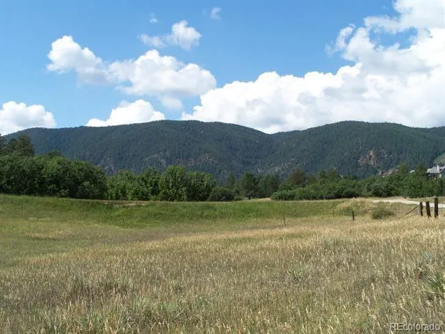 a view of an ocean and a mountain