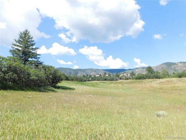 a view of a tree in front of a building