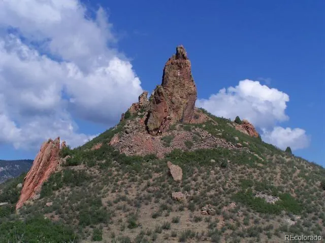 a view of a town with mountains in the background