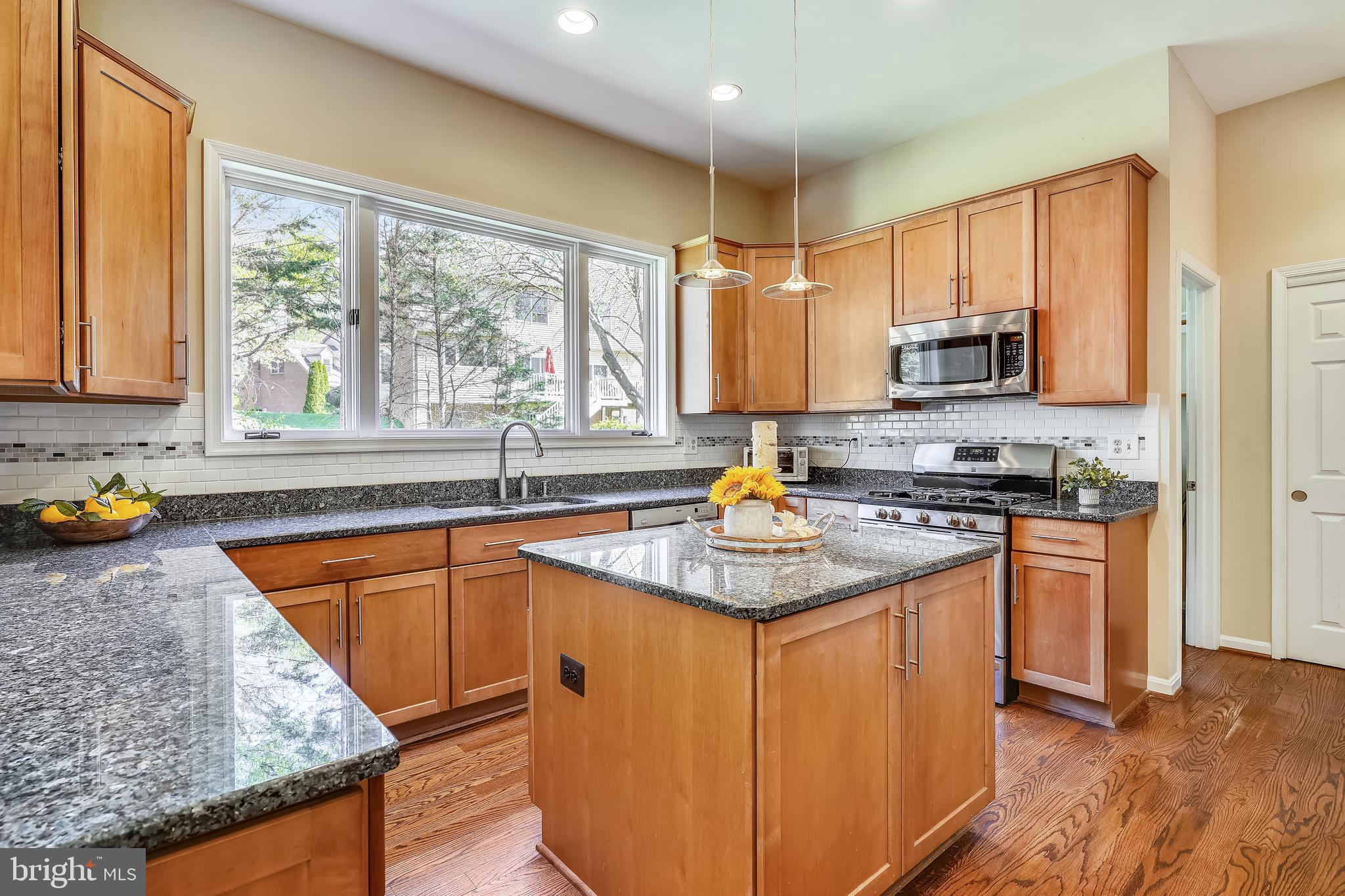 Gas range and granite counter tops.