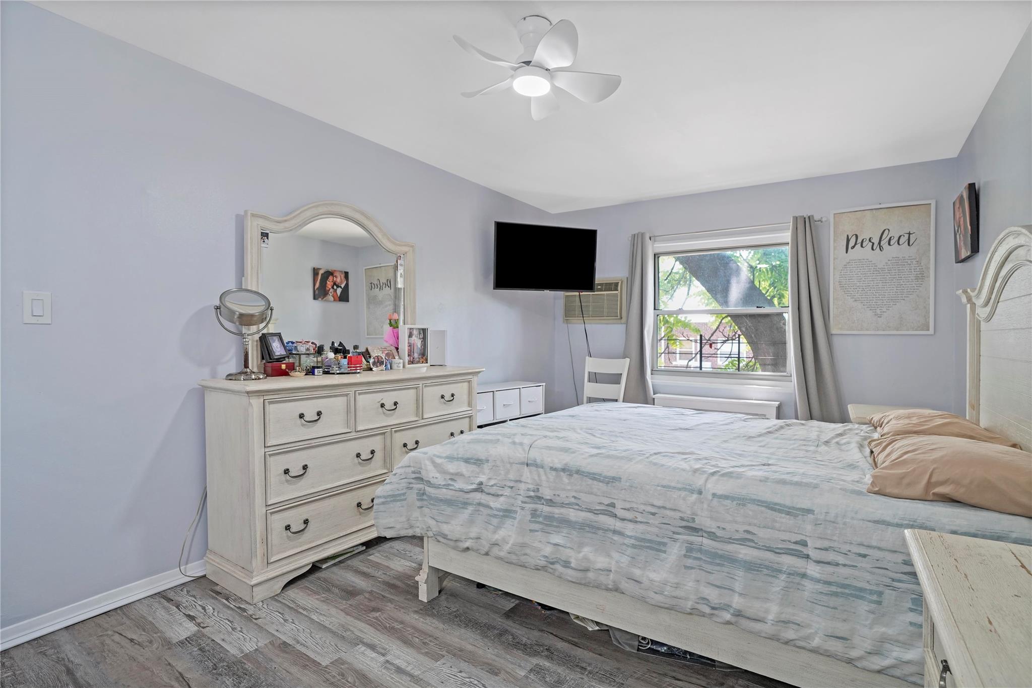 1001 Shore Parkway, Unit 2B Brooklyn, NY 11228 - Photo 14 of 23 a bedroom with a bed and a flat screen tv