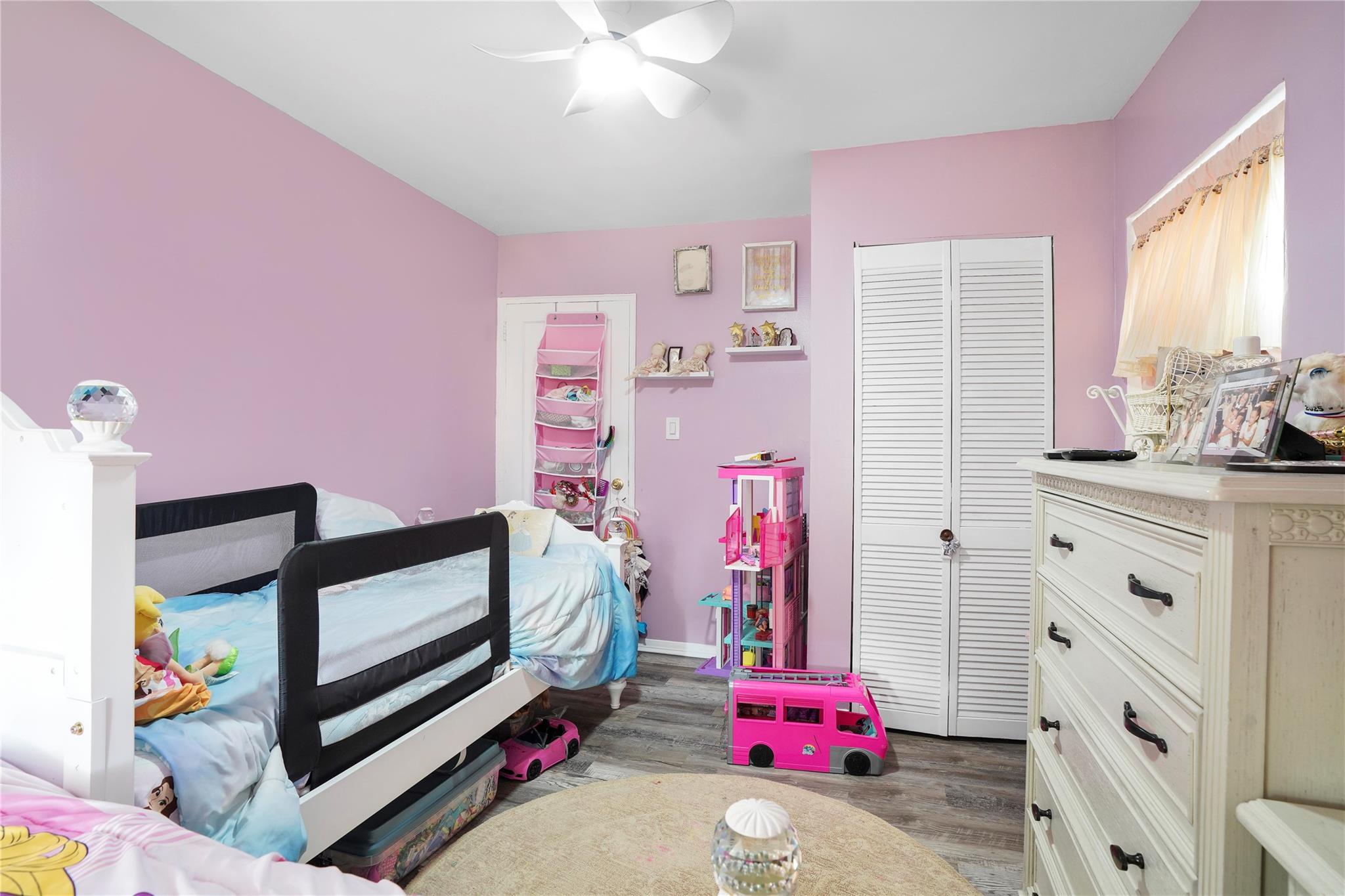 1001 Shore Parkway, Unit 2B Brooklyn, NY 11228 - Photo 17 of 23 a bedroom with a bed and a dresser