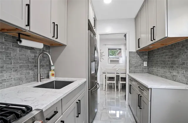 a kitchen with a sink and cabinets