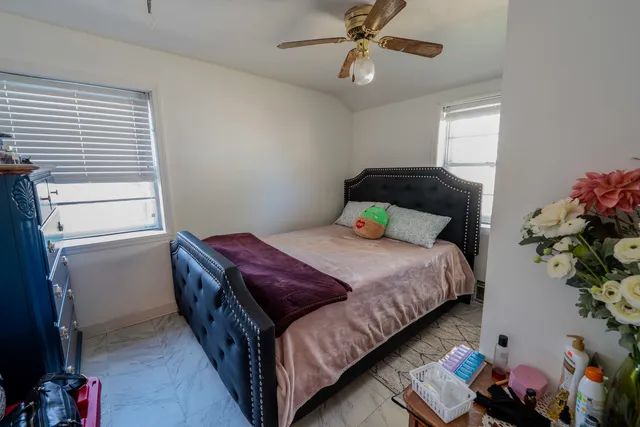 a view of a pathway of a house with a yard