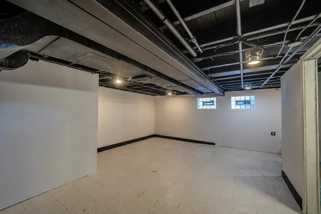 a view of a room with wooden walls