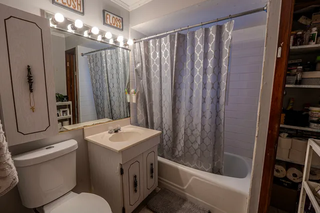 a view of a pathway of a house with a yard