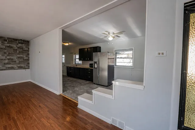 a view of a kitchen from the hallway