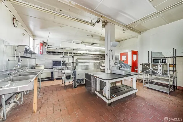 a kitchen with lots of counter top space and appliances
