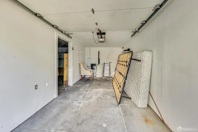 a kitchen with a refrigerator a sink and cabinets