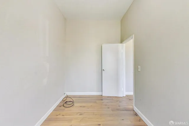 a kitchen with white cabinets sink and white appliances