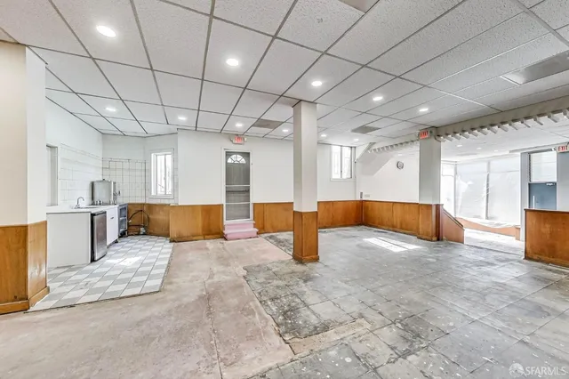 a kitchen with stainless steel appliances granite countertop a stove and a refrigerator