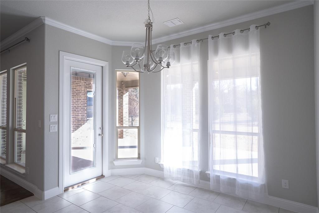 181 Fairview Court Decatur, TX 76234 - Photo 13 of 35 a view of a bathroom with a shower and a chandelier