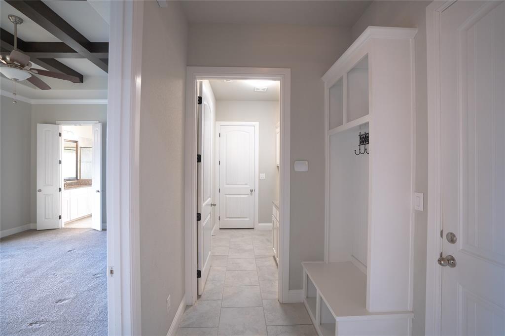 181 Fairview Court Decatur, TX 76234 - Photo 25 of 35 a view of a hallway with wooden floor and a bathroom