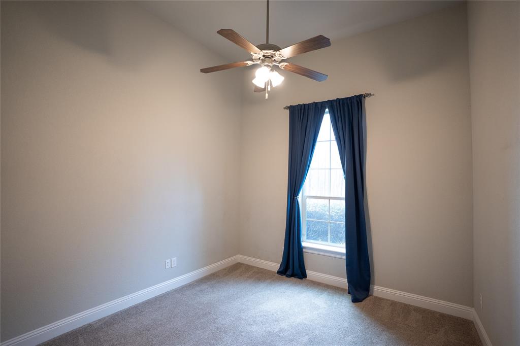 181 Fairview Court Decatur, TX 76234 - Photo 35 of 35 an empty room with windows and fan
