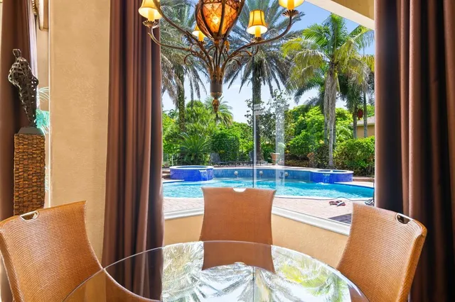 a view of a chair and tables in the balcony