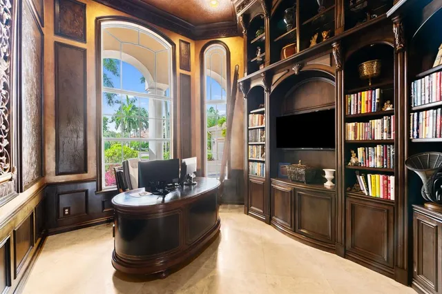 a living room with fireplace furniture and a flat screen tv