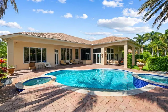 a view of a house with backyard porch and patio