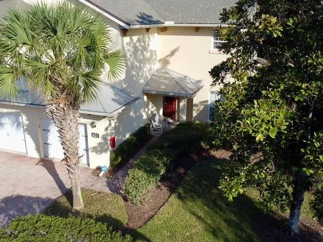 an aerial view of a house with yard swimming pool and outdoor seating