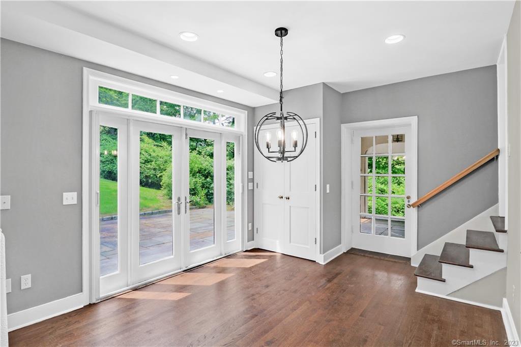 55 Mountain Road Wilton, CT 06897 - Photo 1 of 1 a view of an empty room with wooden floor and a window